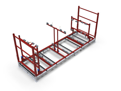 Langes Transportgestell mit verzinkter Basis und rotem Stahlrahmen, ausgestattet mit Halterungen und Vorrichtungen zur sicheren Fixierung von Bauteilen.